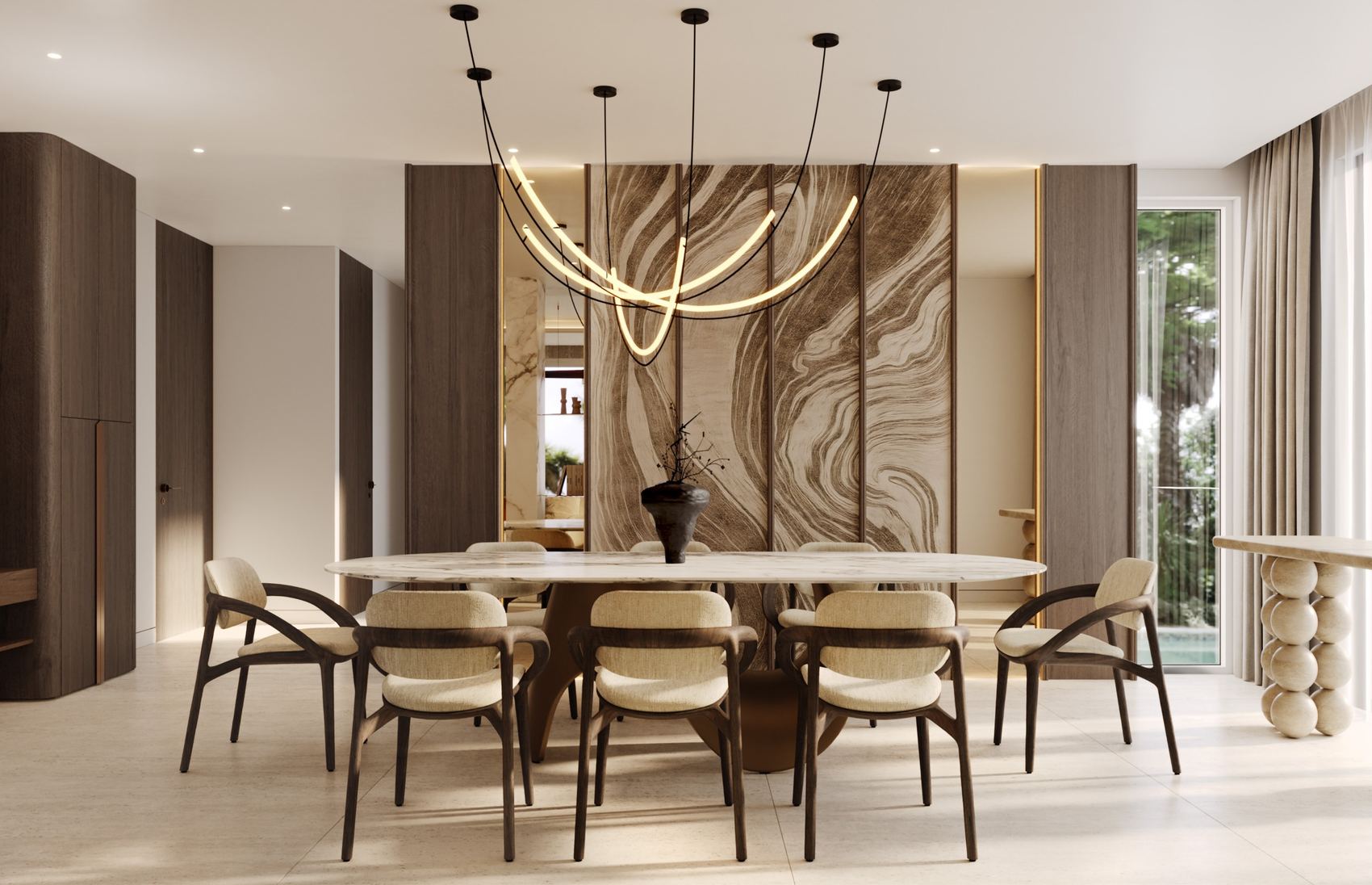 Dining room with an oval marble table beneath a sculptural light