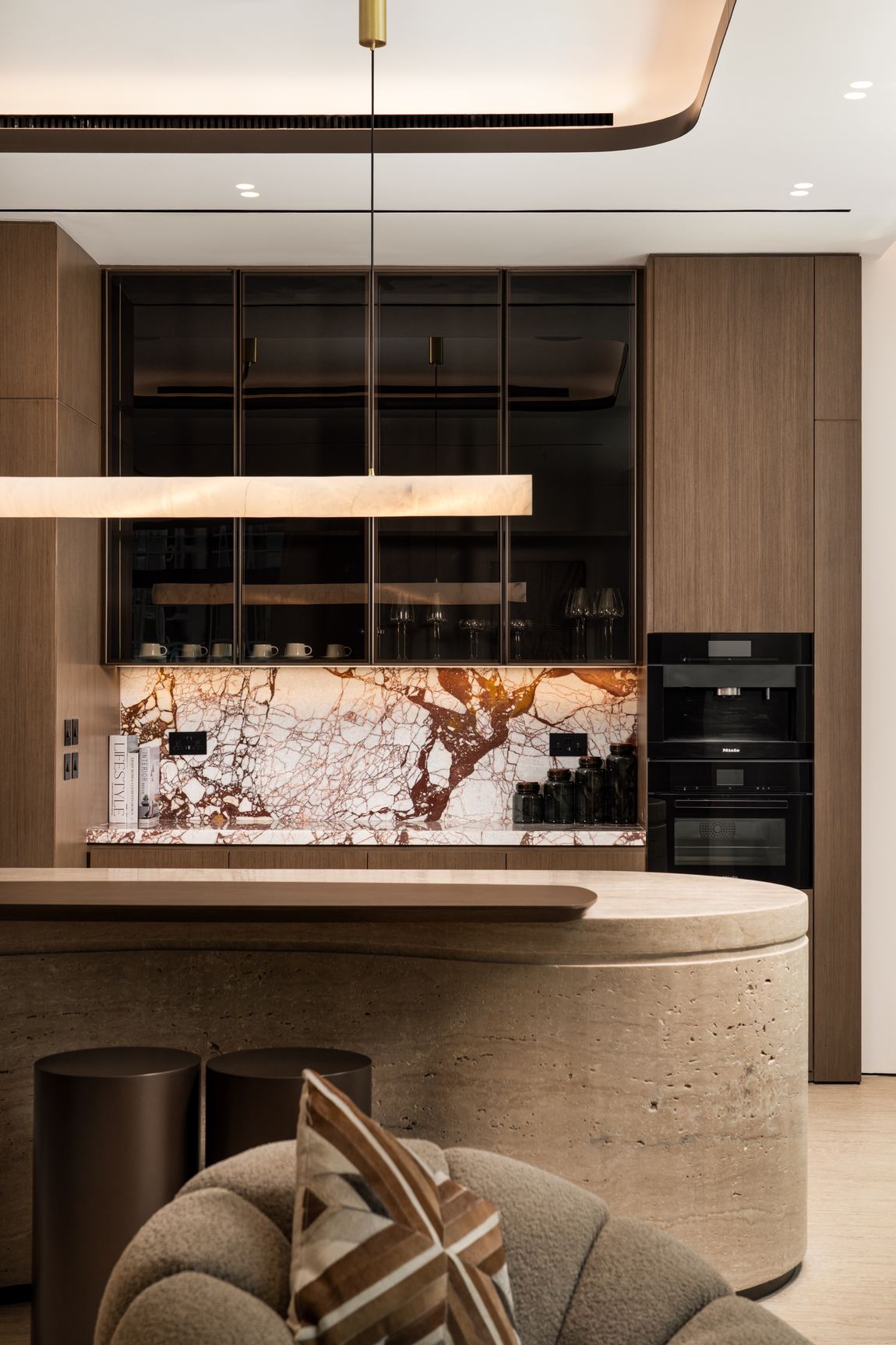 Calacatta Viola splashback behind the kitchen run, lit from beneath the cabinetry